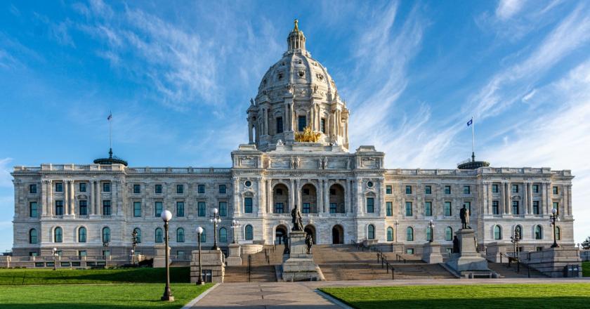 The Minnesota Capitol with white clouds and a blue sky