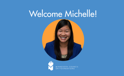 A graphic reading "Welcome Michelle!" featuring a head shot of Michelle Tran Maryns