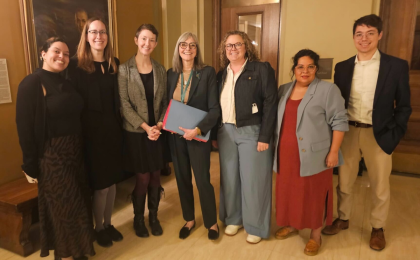 Group of MCF staff and partners pose together at the Minnesota House