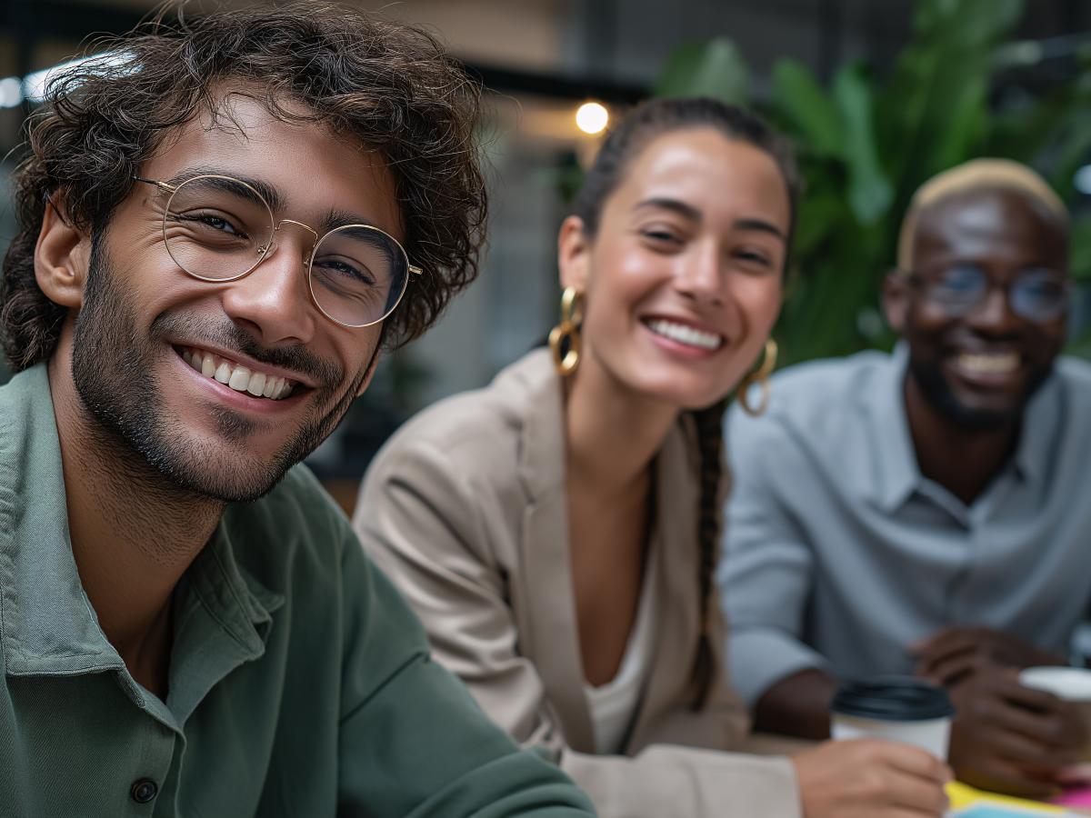 Three people smiling